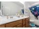 Bathroom featuring double sink vanity with cabinets and drawers at 12204 W Parkway Ln, Avondale, AZ 85323