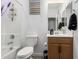 Bathroom with a shower-tub combo and vanity with drawers and cabinet at 12204 W Parkway Ln, Avondale, AZ 85323