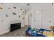 Bright bedroom showcases a toddler bed, television, and sliding closet doors at 12204 W Parkway Ln, Avondale, AZ 85323