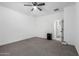 Spacious bedroom with carpet flooring and a ceiling fan at 12204 W Parkway Ln, Avondale, AZ 85323