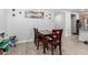 Cozy dining area featuring wood-look flooring, a wooden dining table set, and a decorative painting, perfect for Gathering meals at 12204 W Parkway Ln, Avondale, AZ 85323