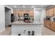 Spacious kitchen featuring a large island with granite countertops, stainless steel appliances, and ample cabinet space for storage at 12204 W Parkway Ln, Avondale, AZ 85323
