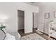 A neutral-toned bedroom showcasing natural light, white doors and trim, and a comfortable bed at 14864 W Riviera Dr, Surprise, AZ 85379