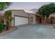 Inviting single-Gathering home featuring a well-maintained lawn, desert landscaping and a welcoming entry at 14864 W Riviera Dr, Surprise, AZ 85379