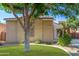 Charming single-story home with a well-maintained lawn and desert-friendly landscaping at 14864 W Riviera Dr, Surprise, AZ 85379
