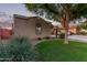 A well-manicured front yard leads to the home, complemented by mature landscaping and a welcoming atmosphere at 14864 W Riviera Dr, Surprise, AZ 85379