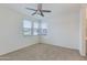 Bedroom featuring natural light through its window, carpeted floors and a ceiling fan at 14870 W Encanto Blvd # 2006, Goodyear, AZ 85395