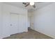 Bedroom with a ceiling fan, carpeted floor, and a closet at 14870 W Encanto Blvd # 2006, Goodyear, AZ 85395