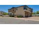 Three-story building with a multi-car garage and street parking at 14870 W Encanto Blvd # 2006, Goodyear, AZ 85395