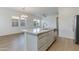 Kitchen featuring granite countertops, white cabinets, stainless steel appliances, and a kitchen island sink at 14870 W Encanto Blvd # 2006, Goodyear, AZ 85395