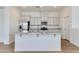 Kitchen featuring white cabinets, marble countertops, stainless steel appliances, and a central island at 14870 W Encanto Blvd # 2006, Goodyear, AZ 85395