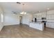 Spacious kitchen with white cabinets, granite counters, stainless appliances, and an open concept floorplan at 14870 W Encanto Blvd # 2006, Goodyear, AZ 85395