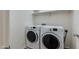 Laundry room with new washer and dryer for convenient in-home laundry, and upper shelf storage at 14870 W Encanto Blvd # 2006, Goodyear, AZ 85395