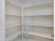 Walk-in pantry with built-in shelving providing ample storage space for food and household items at 14870 W Encanto Blvd # 2006, Goodyear, AZ 85395