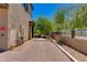 Exterior view of parking area with trees and a brick paved surface at 14870 W Encanto Blvd # 2006, Goodyear, AZ 85395