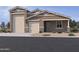 Charming single-Gathering home with three-car garage and desert landscaping at 15730 W Brown St, Waddell, AZ 85355