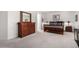 Serene main bedroom with a dresser, nightstands, soft carpet, and neutral color palette at 16972 W Anasazi Ct, Surprise, AZ 85387