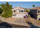 Aerial view of a well-maintained two-story home with a tile roof, spacious driveway, and manicured yard at 1723 E Pontiac Dr, Phoenix, AZ 85024