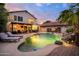 Inviting backyard showcasing a stunning pool, outdoor seating, lush landscaping, and tranquil ambiance at 1723 E Pontiac Dr, Phoenix, AZ 85024