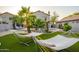 Beautiful backyard with hammocks, lush palm trees, and a sparkling pool for ultimate relaxation at 1723 E Pontiac Dr, Phoenix, AZ 85024