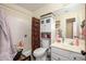 Cozy bathroom featuring tub shower combination with storage above the toilet and under the sink at 1723 E Pontiac Dr, Phoenix, AZ 85024