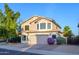 Beautiful two-story home with a well-maintained front yard, mature trees, and a two-car garage at 1723 E Pontiac Dr, Phoenix, AZ 85024