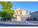 Charming two-story home with a well-manicured front yard and a two-car garage in a sunny neighborhood at 1723 E Pontiac Dr, Phoenix, AZ 85024
