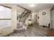 Bright entryway with staircase, wood floors, and charming decor at 1723 E Pontiac Dr, Phoenix, AZ 85024