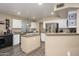 Bright kitchen with stainless steel appliances, granite countertops, a center island, and lots of storage space at 1723 E Pontiac Dr, Phoenix, AZ 85024