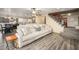 Open-concept living area leading to kitchen, with a staircase and comfortable seating at 1723 E Pontiac Dr, Phoenix, AZ 85024