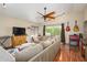 Inviting living space with guitars on the wall, and comfortable sofa at 1723 E Pontiac Dr, Phoenix, AZ 85024