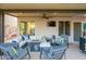 Relaxing outdoor living space with comfortable seating and a cozy fire pit under a covered patio at 1723 E Pontiac Dr, Phoenix, AZ 85024