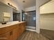 Bathroom features double sinks, and a walk-in shower with sliding glass door at 1736 W Pollack St, Phoenix, AZ 85041