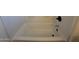 White bathtub with matching tile surround and modern fixtures, great for comfort and relaxation at 1736 W Pollack St, Phoenix, AZ 85041
