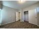Well-lit bedroom features a closet, a white interior door and wood-look tile flooring at 1736 W Pollack St, Phoenix, AZ 85041