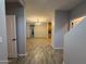 Open-concept living room featuring wood-look tile flooring, neutral paint, and recessed lighting at 1736 W Pollack St, Phoenix, AZ 85041