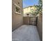 Enclosed patio area with a secure gate and concrete pavers, ideal for privacy at 1736 W Pollack St, Phoenix, AZ 85041