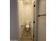 Compact powder room with a modern toilet and stylish wood-look tile flooring at 1736 W Pollack St, Phoenix, AZ 85041