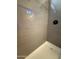 Modern shower with tiled walls and floor and glass-enclosed shower at 1736 W Pollack St, Phoenix, AZ 85041
