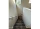Carpeted staircase with a handrail, providing a safe and elegant transition between floors at 1736 W Pollack St, Phoenix, AZ 85041