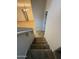 Carpeted staircase, descends into the living area with sleek flooring and modern lighting at 1736 W Pollack St, Phoenix, AZ 85041