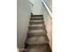 Carpeted staircase leading to the upper level, providing a comfortable and safe transition at 1736 W Pollack St, Phoenix, AZ 85041