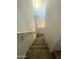 Carpeted staircase descends, providing access to the lower level of the home at 1736 W Pollack St, Phoenix, AZ 85041