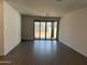 Spacious living room with sliding glass doors that offer lots of natural light at 18232 W La Senda Dr, Surprise, AZ 85387