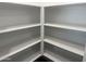 Walk-in pantry featuring white shelving at 18232 W La Senda Dr, Surprise, AZ 85387