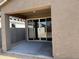 A covered patio with sliding glass doors at 18232 W La Senda Dr, Surprise, AZ 85387
