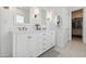 Elegant bathroom featuring a double vanity, modern fixtures, and ample storage space at 20312 W Sells Dr, Buckeye, AZ 85396