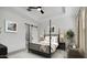 Beautiful bedroom with a four-poster bed, elegant artwork, and soft, neutral tones at 20312 W Sells Dr, Buckeye, AZ 85396