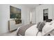 Bedroom featuring a serene color palette, stylish decor, and a view of a closet at 20312 W Sells Dr, Buckeye, AZ 85396