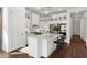 Bright kitchen features a large island, stainless steel appliances, and pendant lighting at 20312 W Sells Dr, Buckeye, AZ 85396